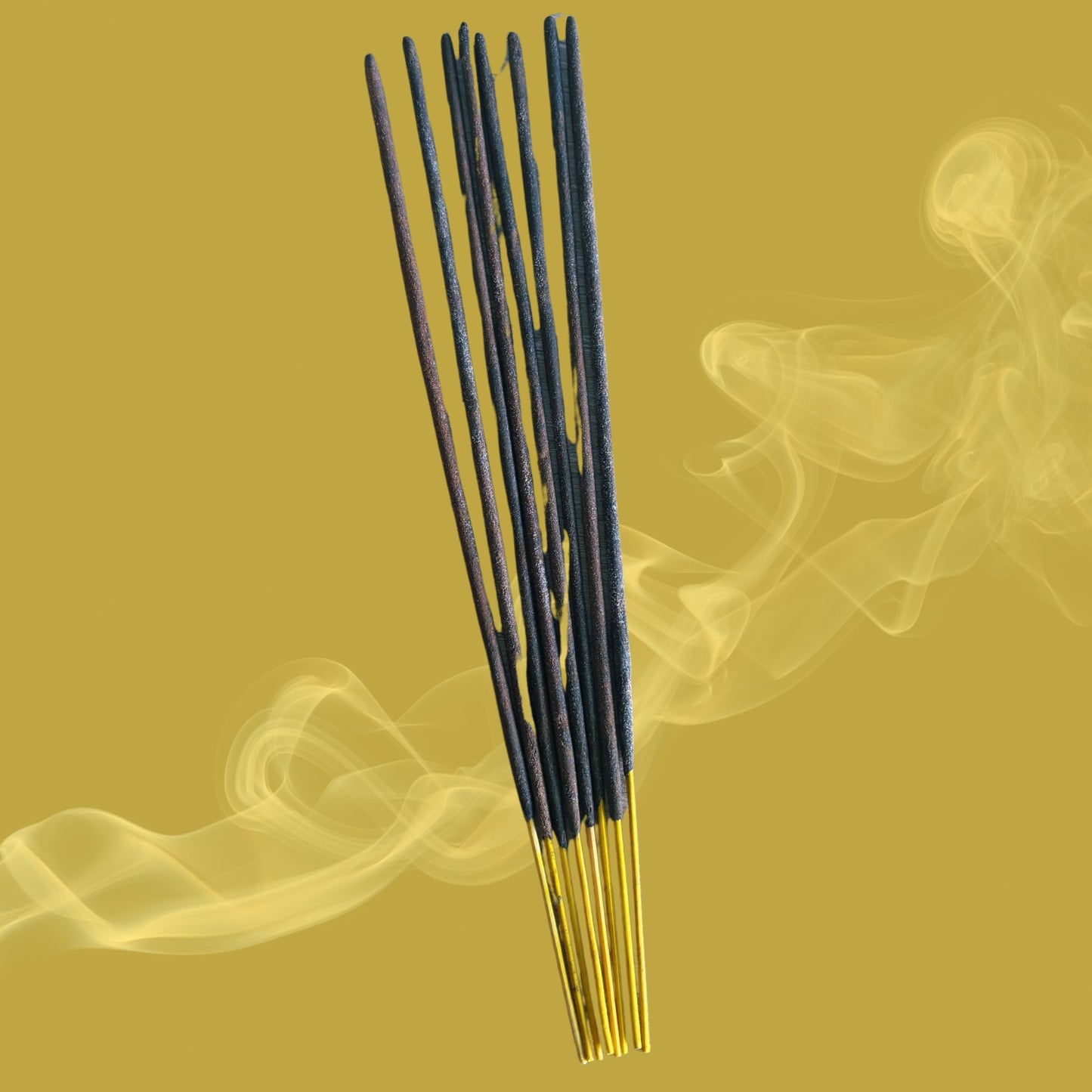 Incense sticks with smoke on a yellow background