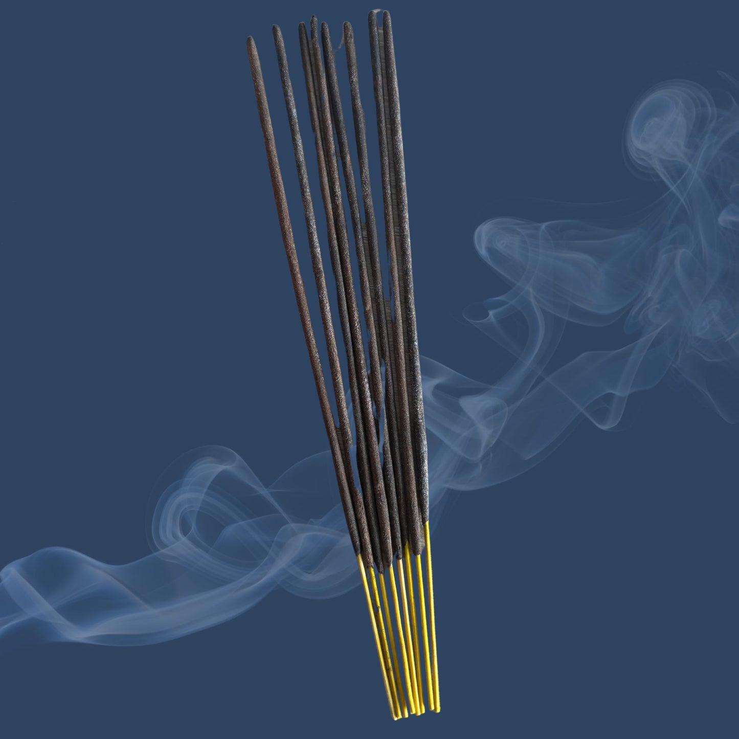 Incense sticks with smoke on a dark blue background